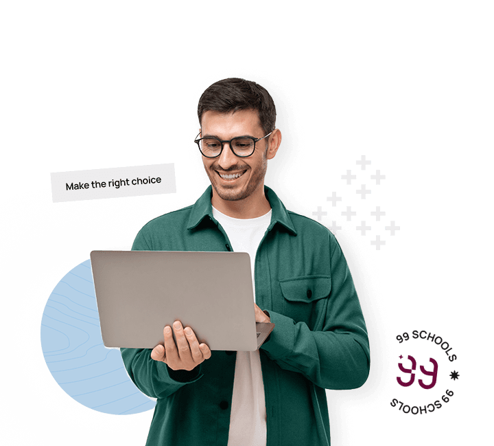 Man holding laptop with one hand and using it with another while smiling